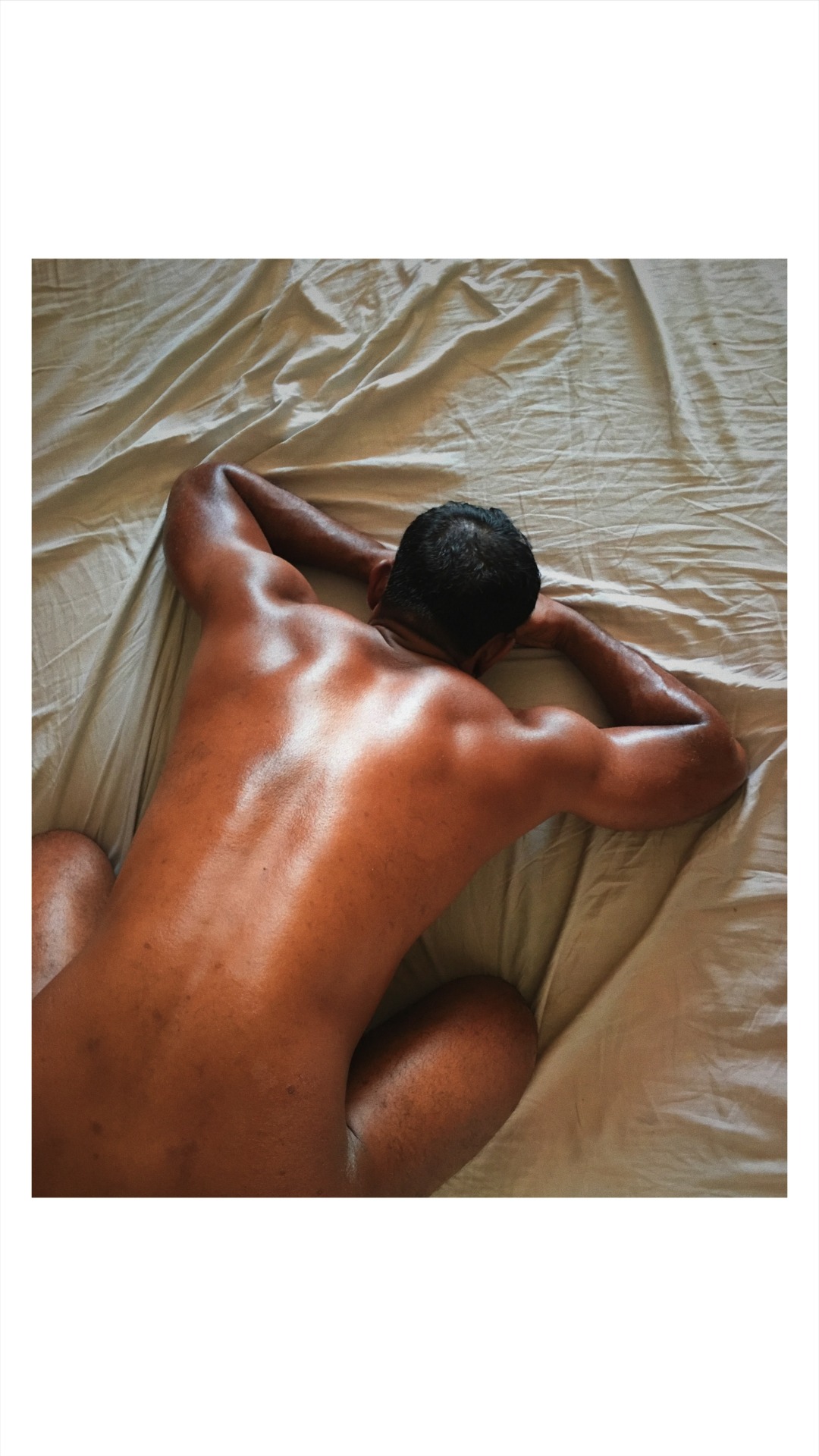 handsome indian hunk in bed bent over